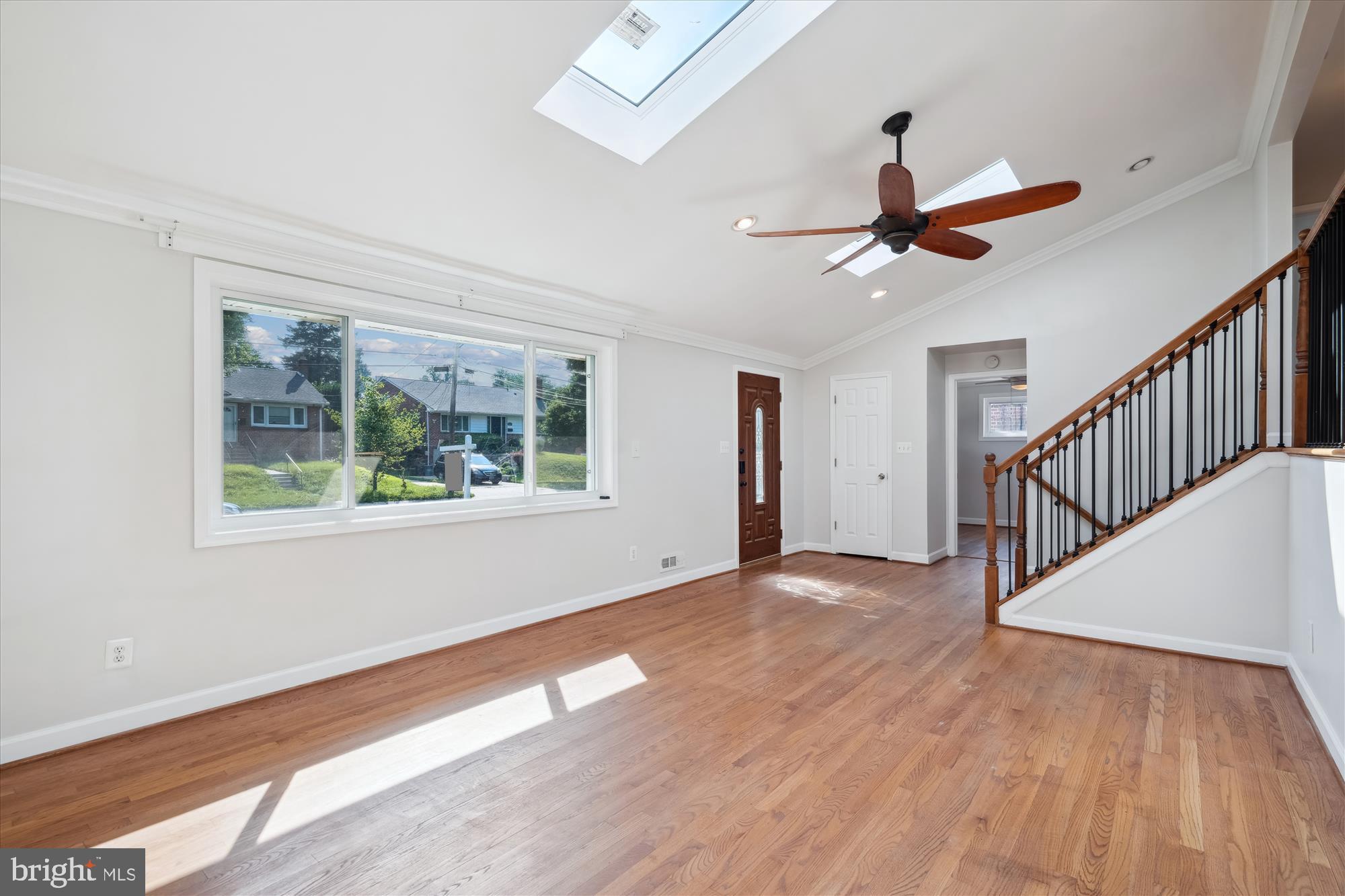 12812 Crisfield Road Silver Spring, MD 20906 - Photo 36 of 83 a view of an empty room with wooden floor and a window