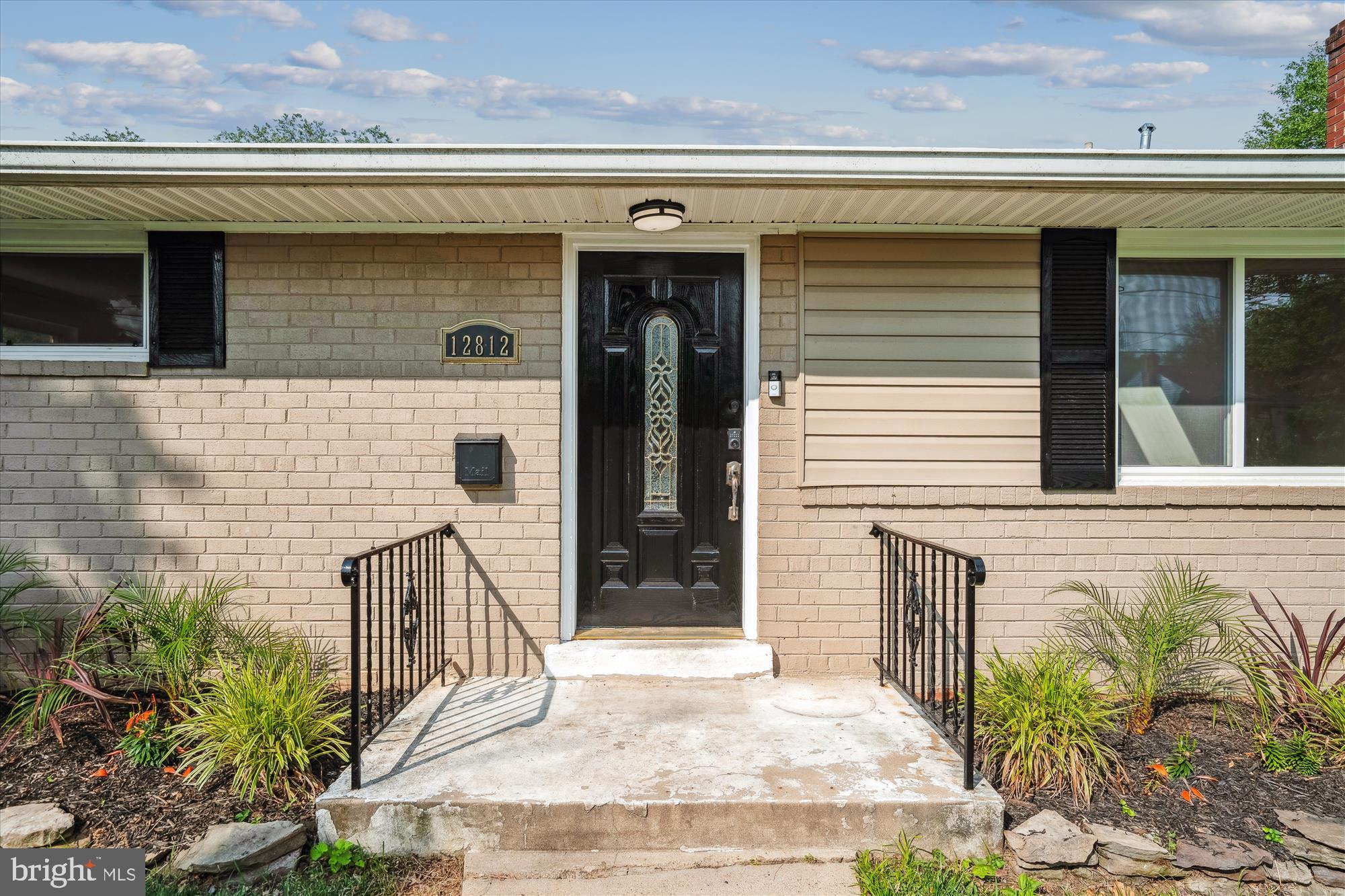 12812 Crisfield Road Silver Spring, MD 20906 - Photo 40 of 83 a front view of a house with a yard