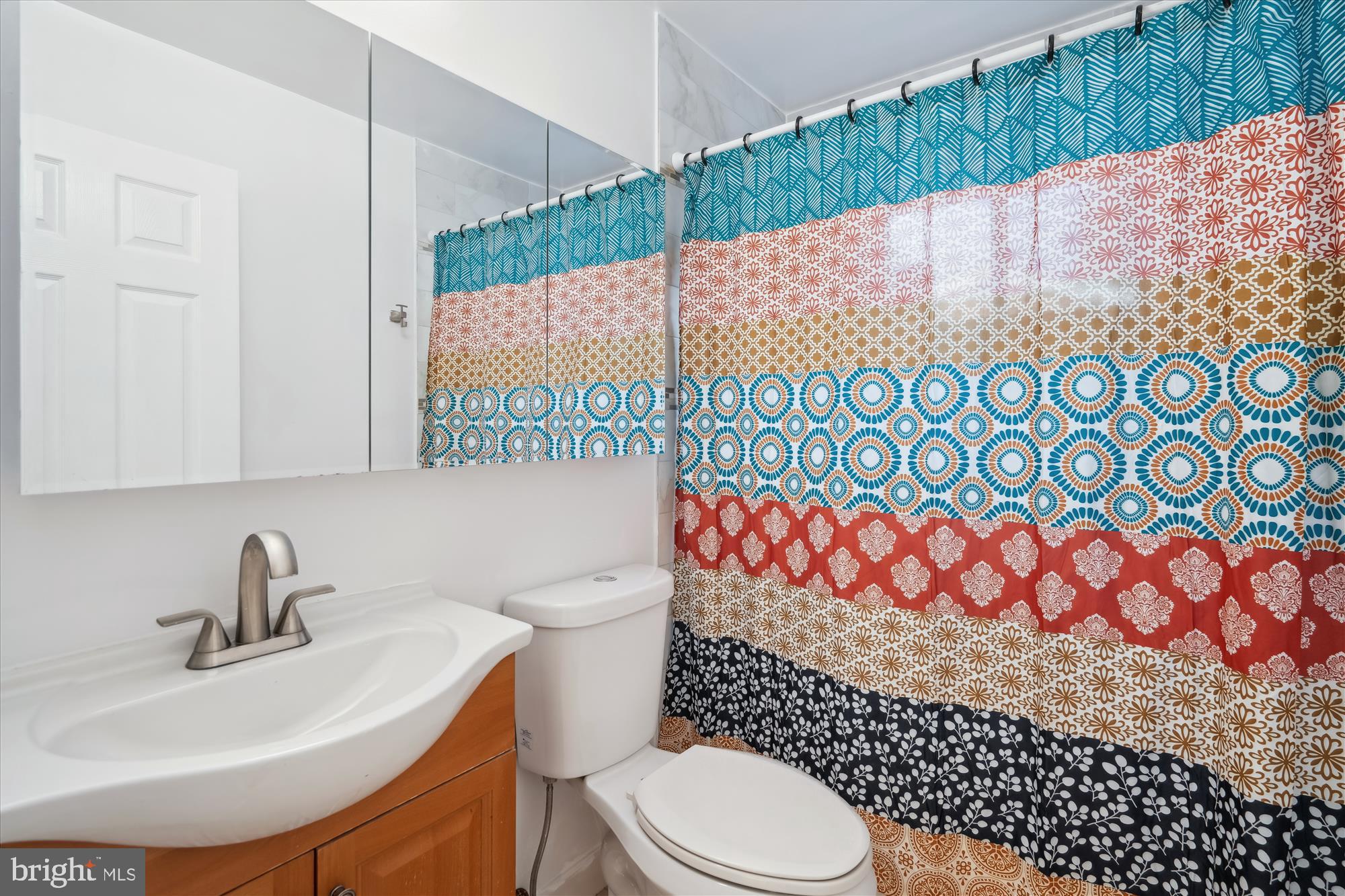 12812 Crisfield Road Silver Spring, MD 20906 - Photo 43 of 83 a bathroom with a sink toilet and shower