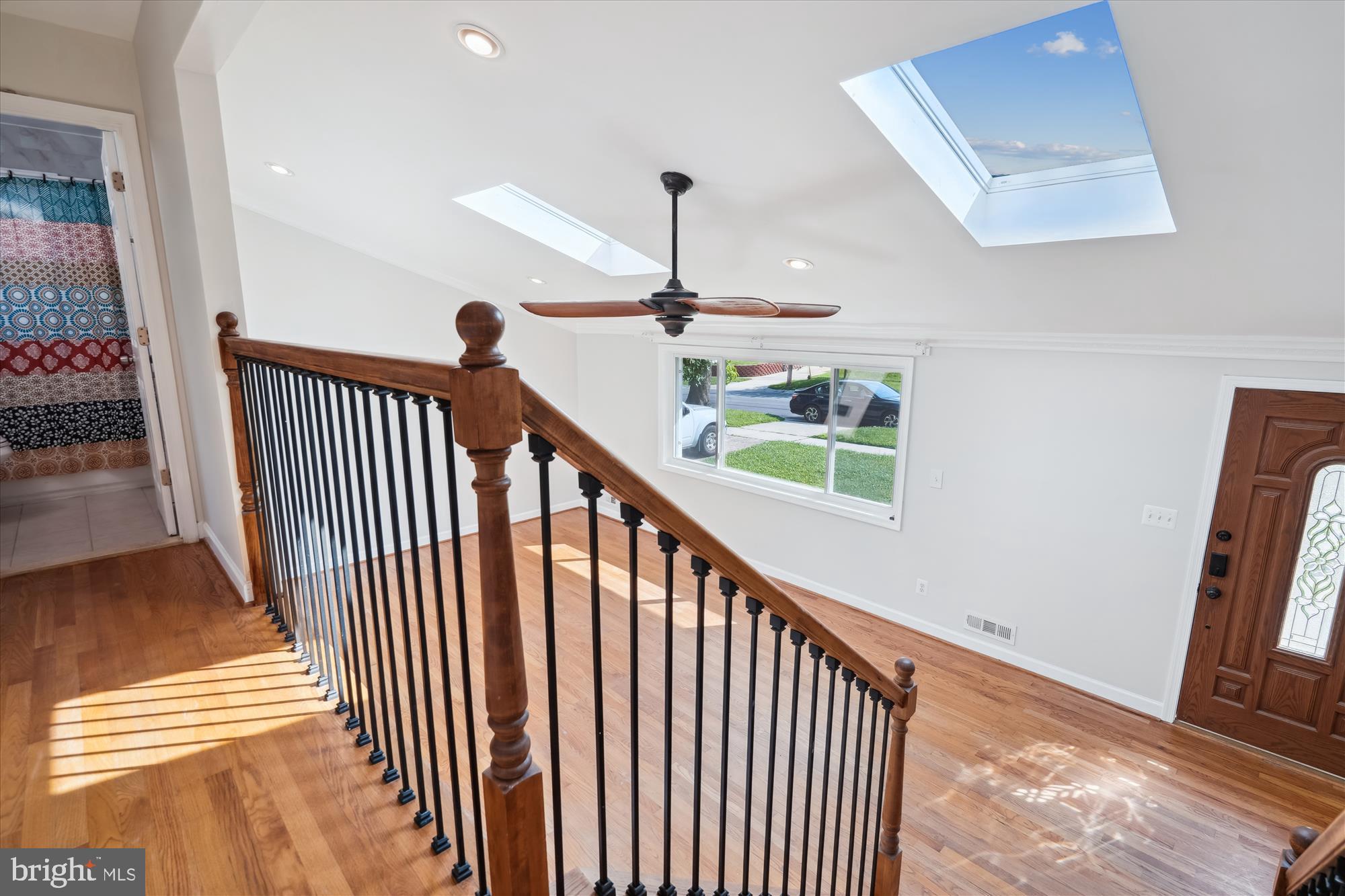 12812 Crisfield Road Silver Spring, MD 20906 - Photo 52 of 83 a view of a hallway with wooden floor and stairs