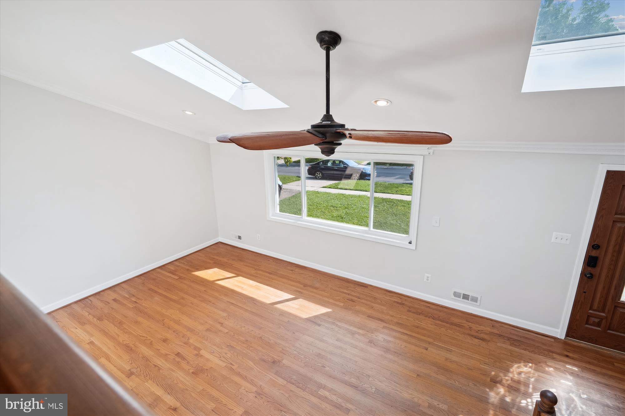 12812 Crisfield Road Silver Spring, MD 20906 - Photo 54 of 83 a view of an empty room with window and wooden floor