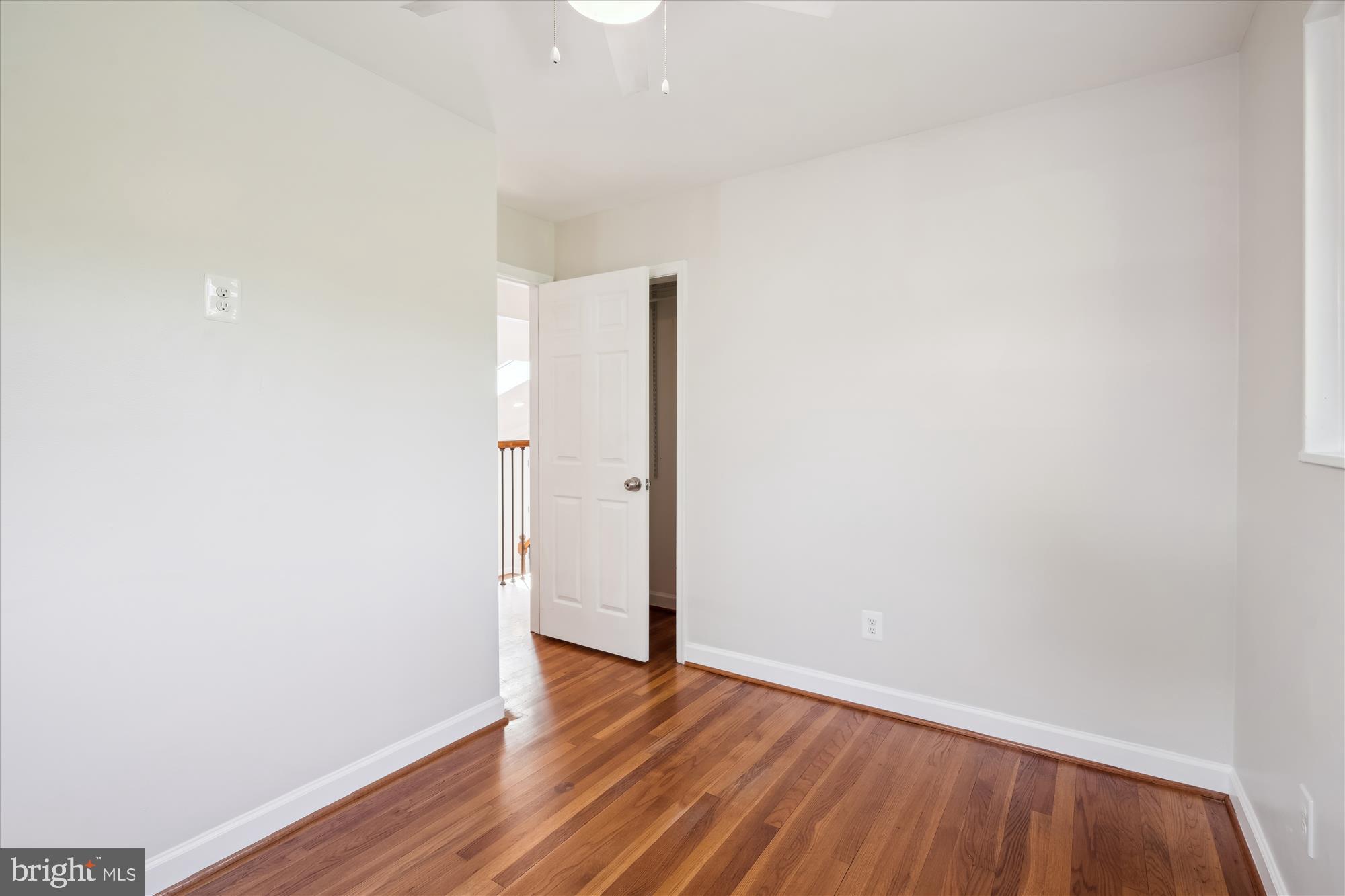 12812 Crisfield Road Silver Spring, MD 20906 - Photo 55 of 83 a view of an empty room with wooden floor
