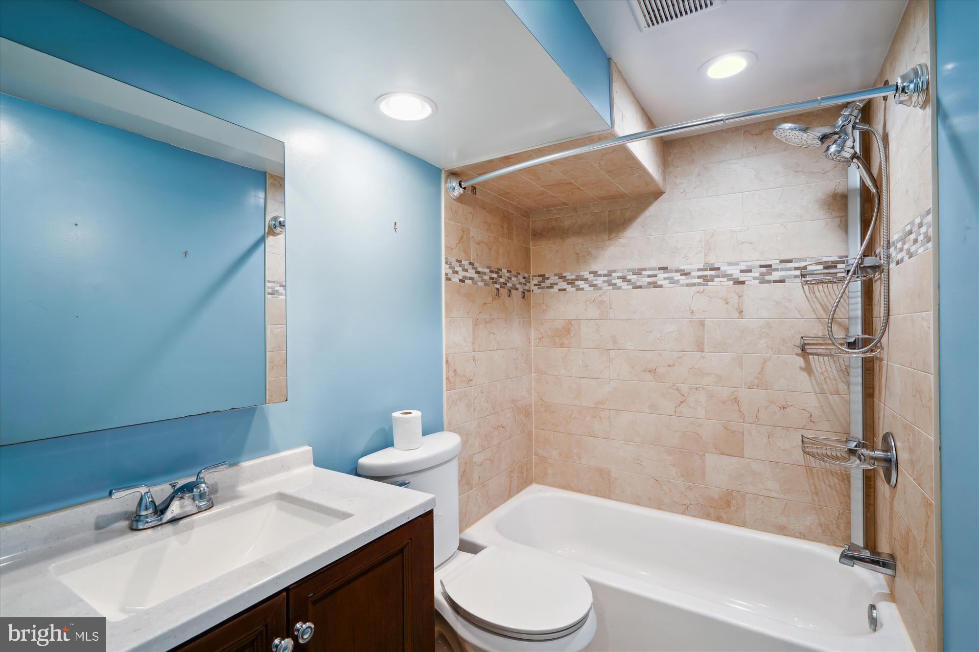12812 Crisfield Road Silver Spring, MD 20906 - Photo 56 of 83 a bathroom with a sink toilet and shower