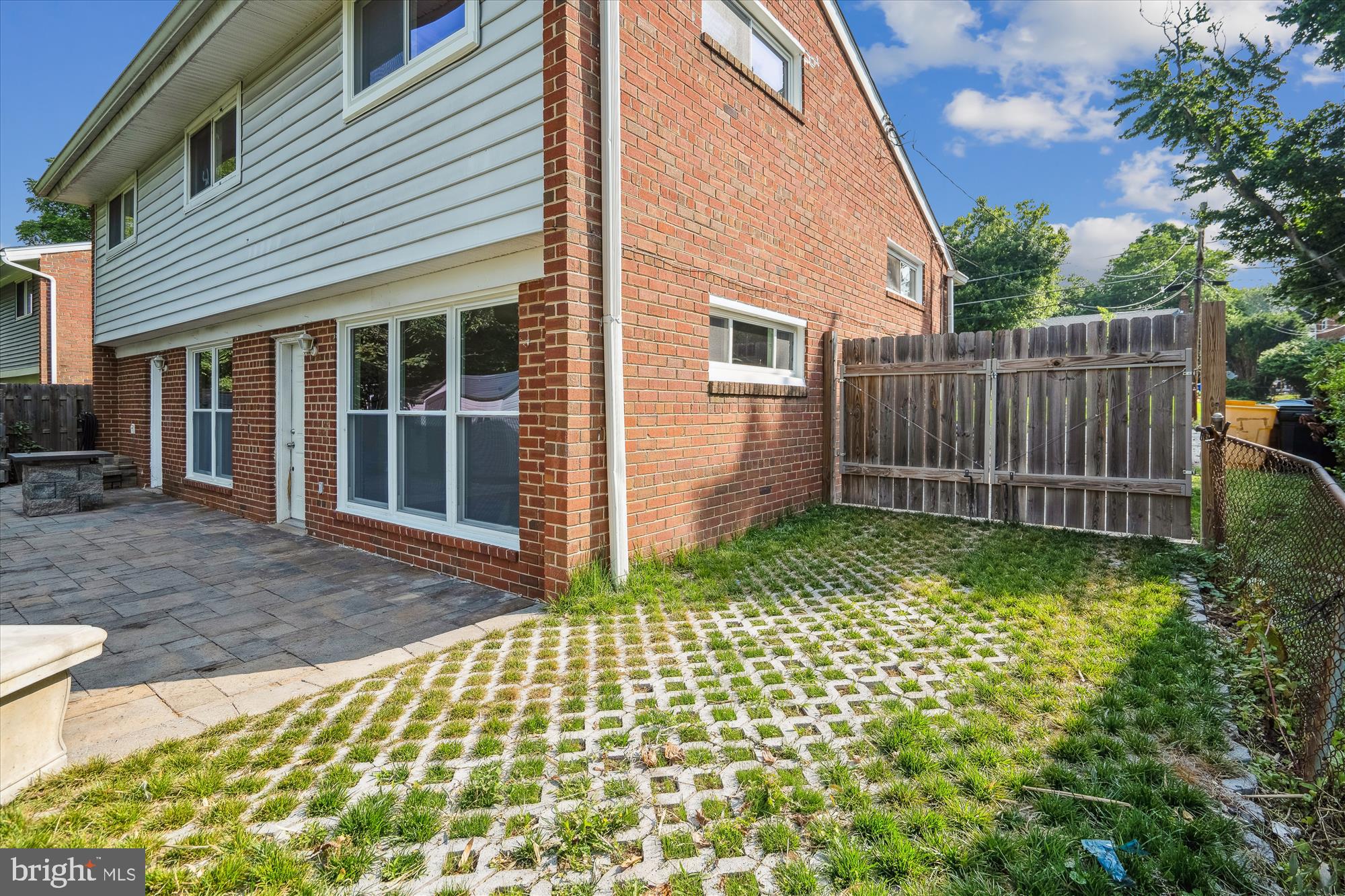 12812 Crisfield Road Silver Spring, MD 20906 - Photo 7 of 83 a backyard of a house with plants and wooden fence
