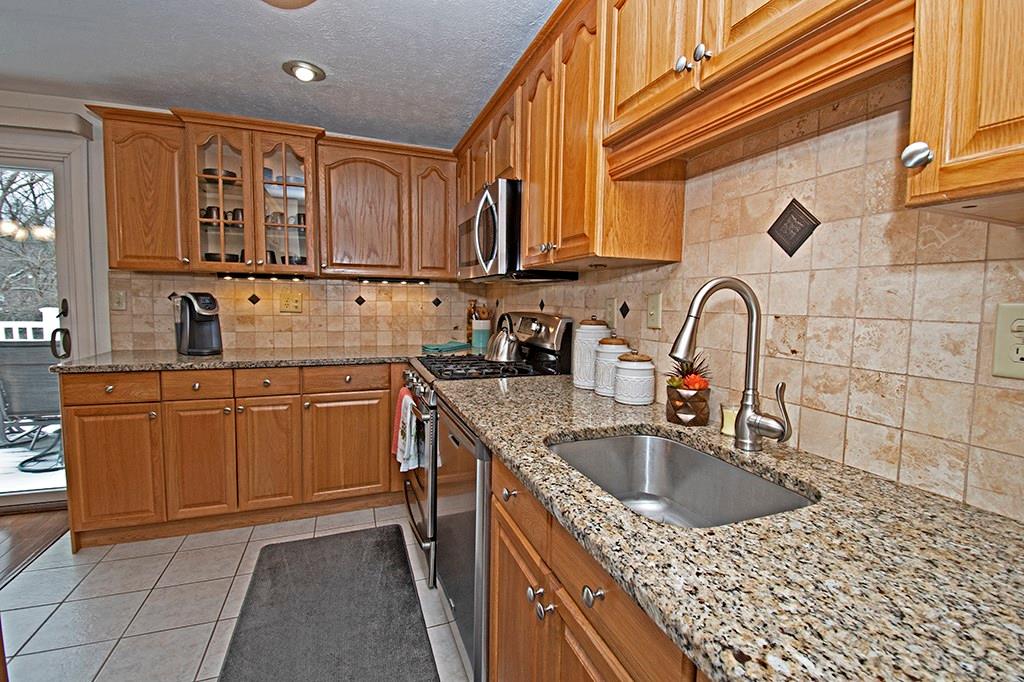 Completely updated kitchen with granite counters and stainless steel appliances