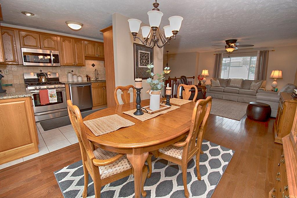Open floor plan with hardwood floors throughout