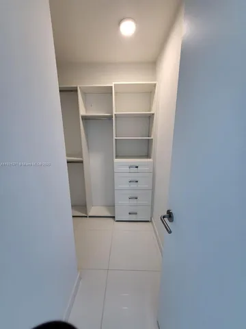 a view of an empty walk in closet