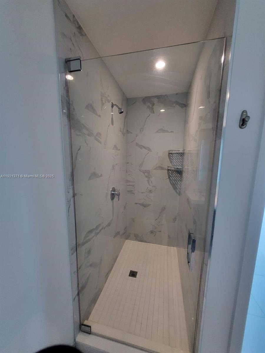 851 Northeast 1st Avenue, Unit 2008 Miami, FL 33132 - Photo 13 of 18 a bathroom with a shower