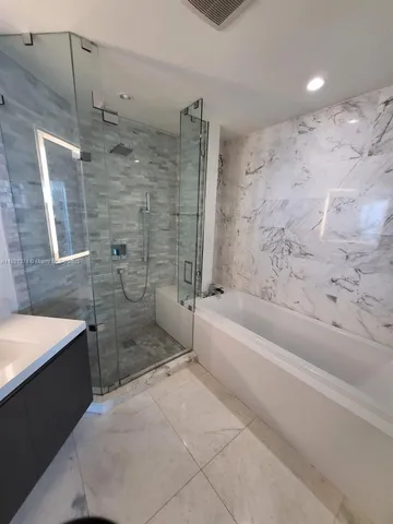 a bathroom with a sink and a bathtub