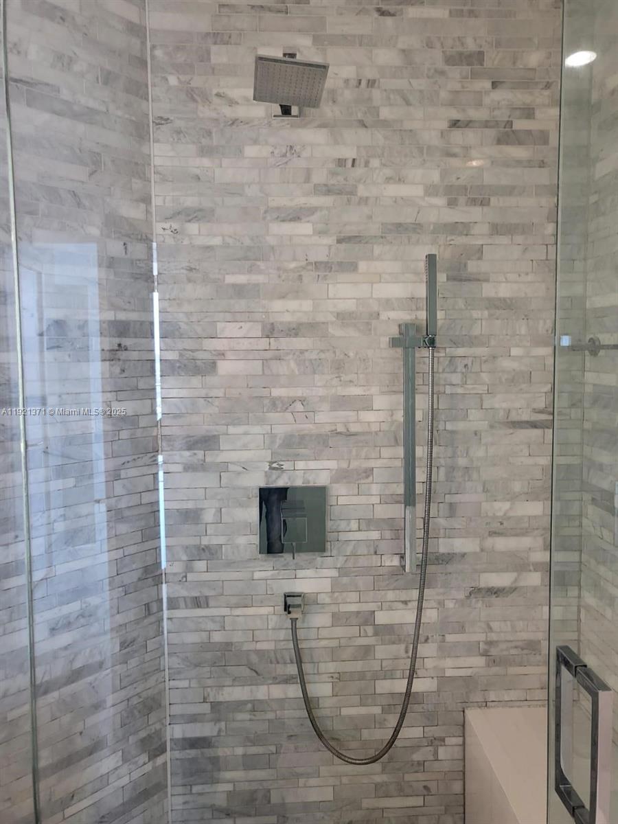 851 Northeast 1st Avenue, Unit 2008 Miami, FL 33132 - Photo 5 of 18 a bathroom with a shower