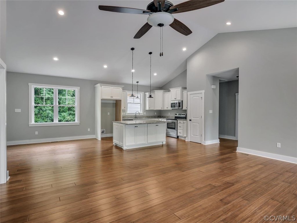 3793 Old Ridge Road Farmville, VA 23901 - Photo 5 of 27 an open kitchen with white cabinets and stainless steel appliances