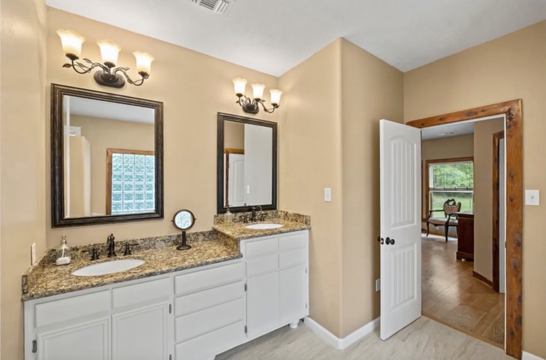 30338 Riley Road Waller, TX 77484 - Photo 23 of 46 a en suite bathroom with a granite countertop sink and a mirror
