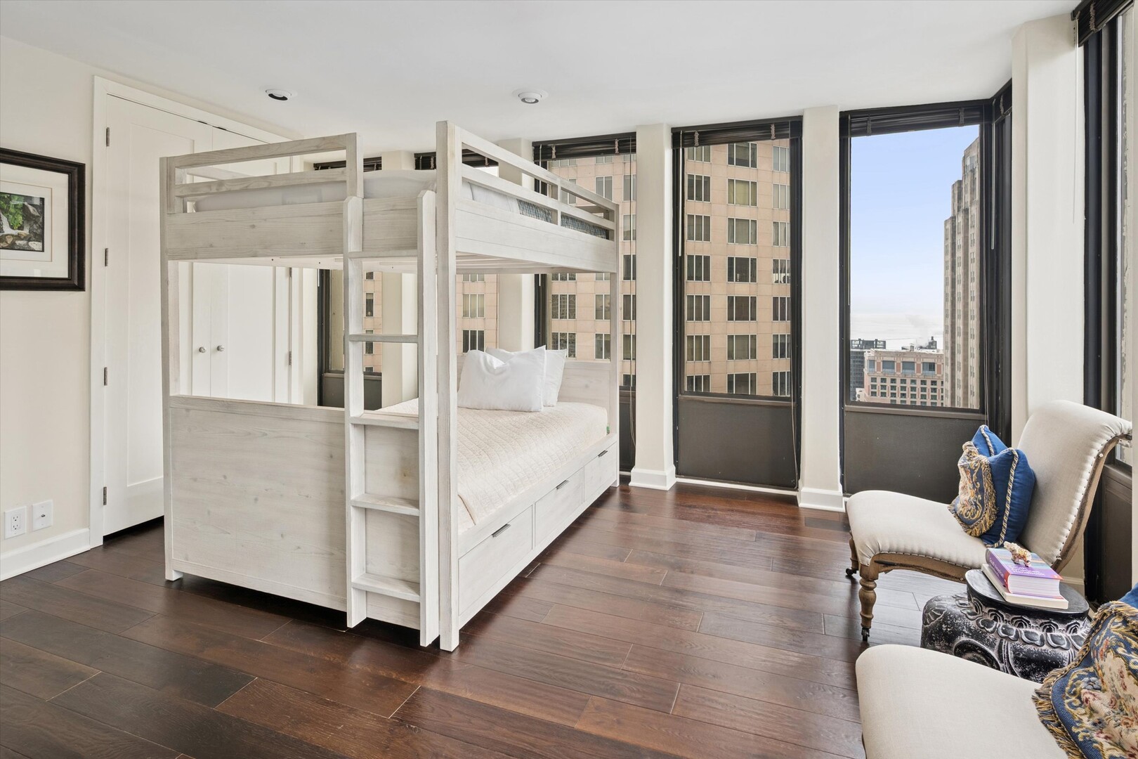 100 East Walton Street, Unit 41DE Chicago, IL 60611 - Photo 17 of 35 a large white bed sitting in a bedroom next to a window