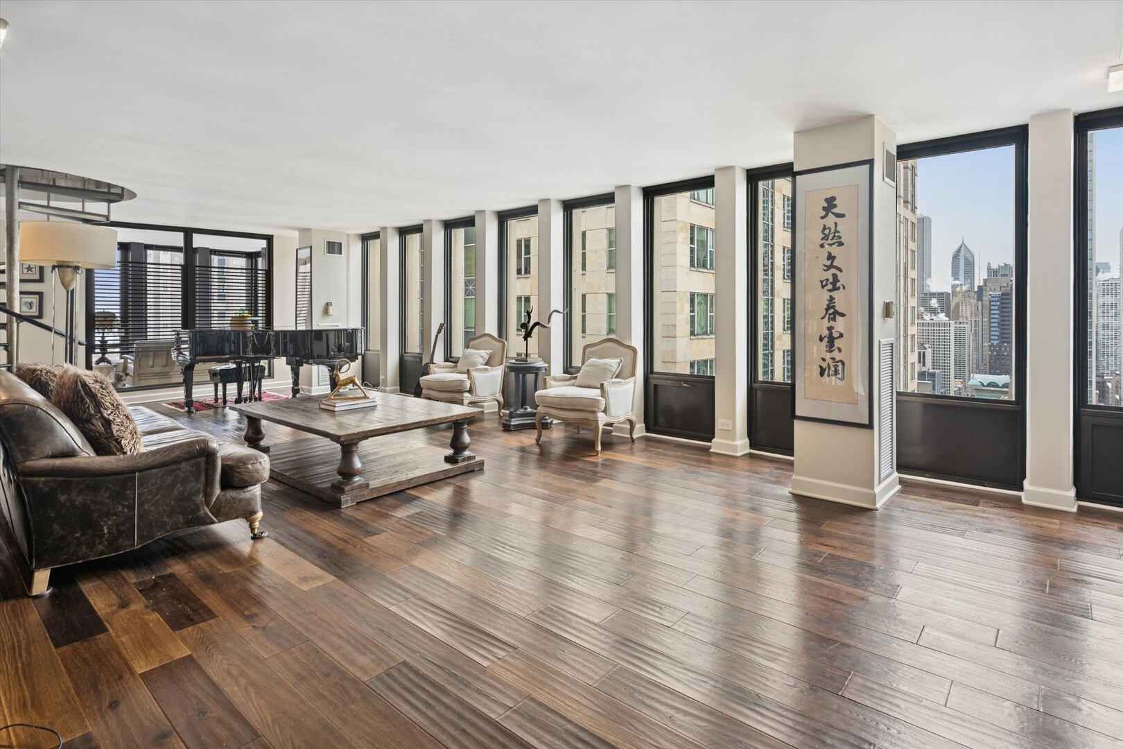100 East Walton Street, Unit 41DE Chicago, IL 60611 - Photo 2 of 35 a living room with furniture and large window with wooden floor