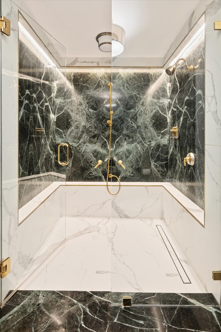 100 East Walton Street, Unit 41DE Chicago, IL 60611 - Photo 27 of 35 a bathroom with a bathtub and shower