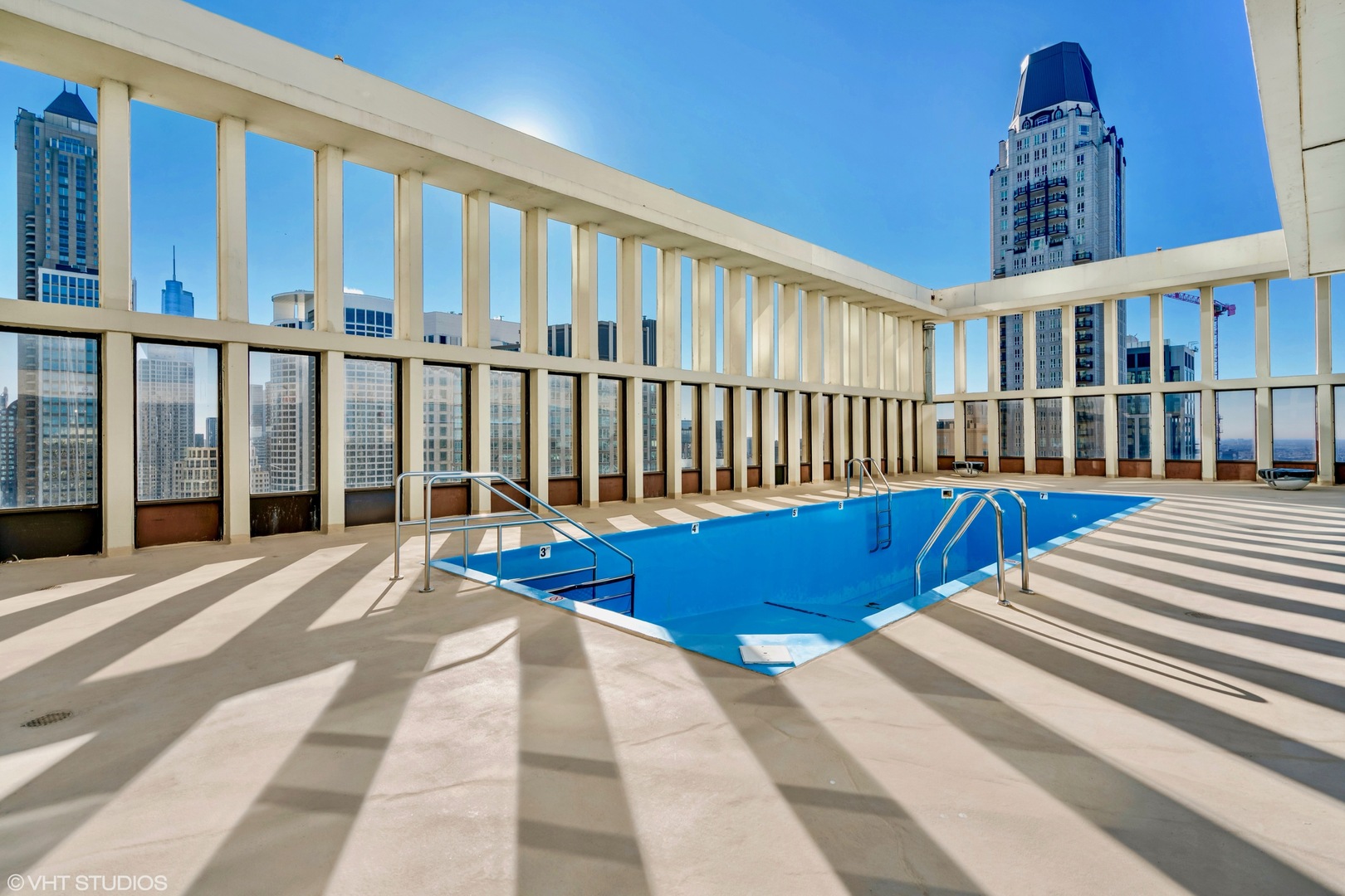 100 East Walton Street, Unit 41DE Chicago, IL 60611 - Photo 29 of 35 a view of swimming pool with deck and a floor to ceiling window