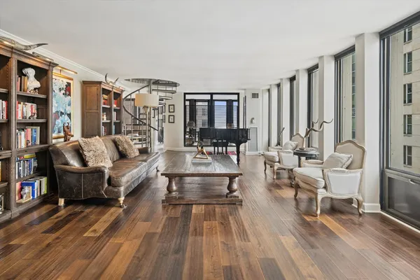 a living room with furniture and a rug