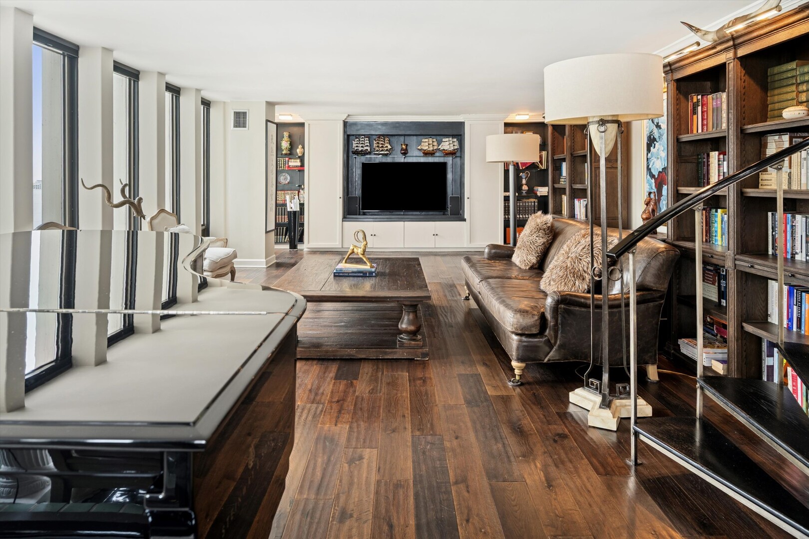 100 East Walton Street, Unit 41DE Chicago, IL 60611 - Photo 4 of 35 a living room with lots of furniture and a flat screen tv