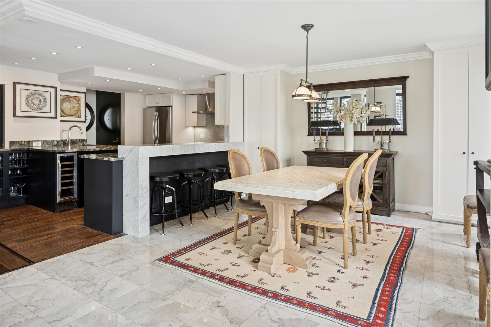 100 East Walton Street, Unit 41DE Chicago, IL 60611 - Photo 7 of 35 a view of kitchen island with furniture and wooden floor