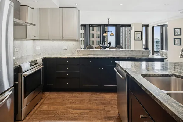 a kitchen with a sink and cabinets