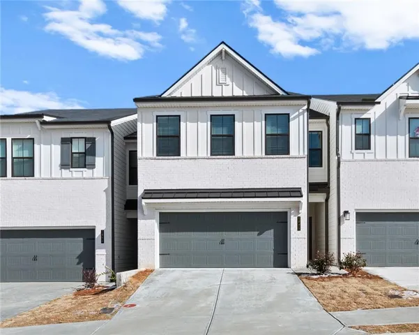 a front view of a house with yard