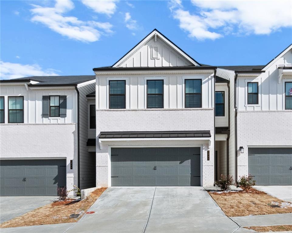 1925 Westwind Street Lawrenceville, GA 30043 - Photo 1 of 27 a front view of a house with yard