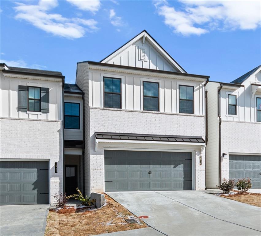 1925 Westwind Street Lawrenceville, GA 30043 - Photo 2 of 27 a front view of a house with a yard