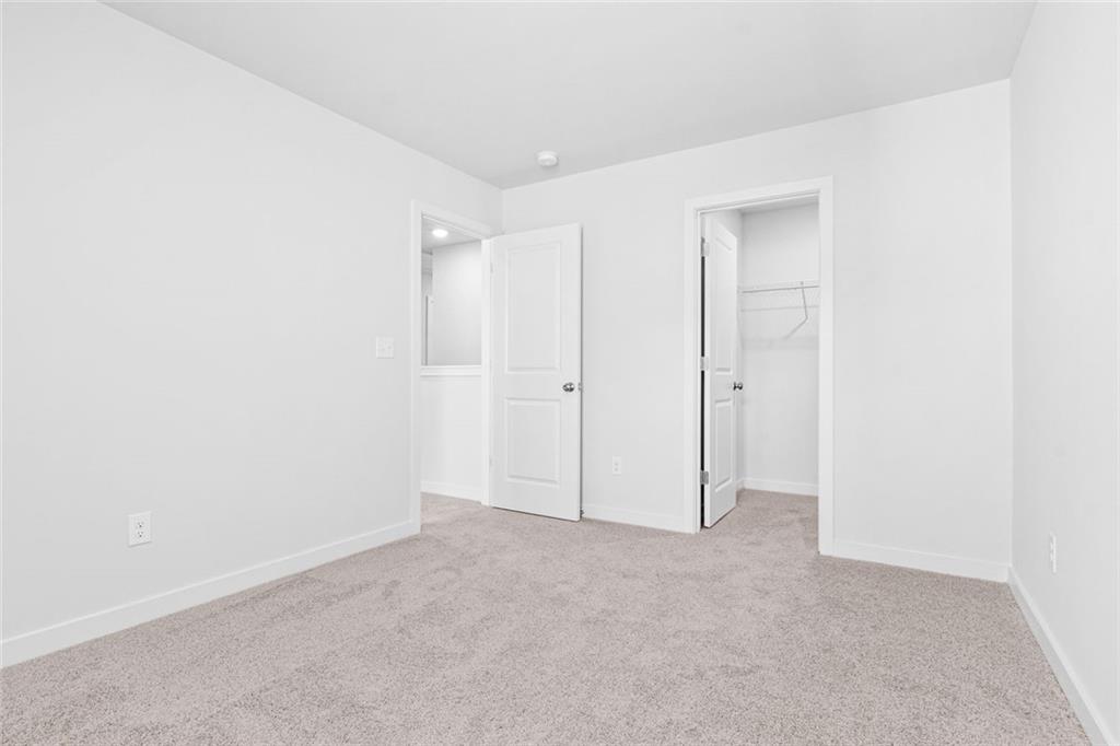 1925 Westwind Street Lawrenceville, GA 30043 - Photo 21 of 27 an empty room with an entryway
