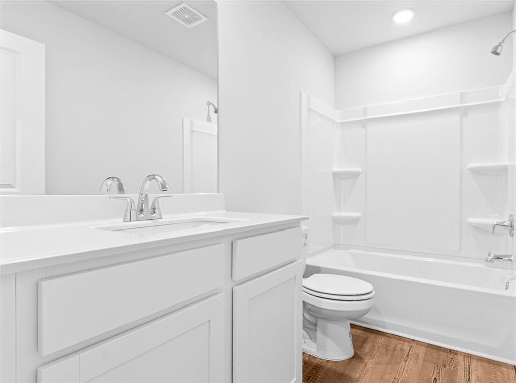 1925 Westwind Street Lawrenceville, GA 30043 - Photo 24 of 27 a bathroom with a sink toilet and shower