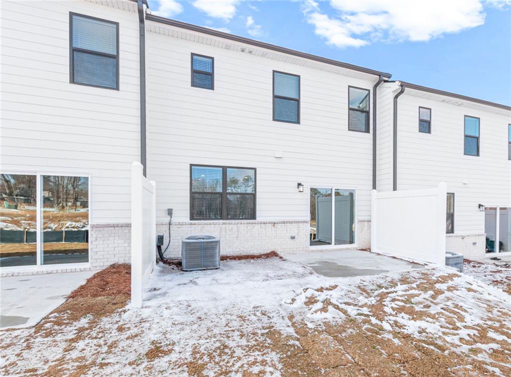 1925 Westwind Street Lawrenceville, GA 30043 - Photo 25 of 27 a view of a house with a backyard