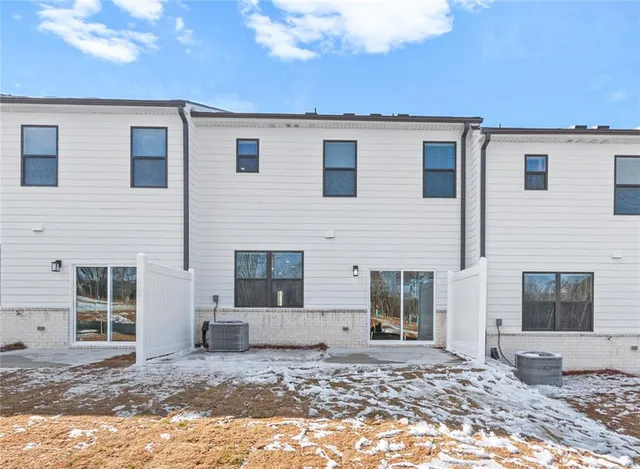 a view of a house with a yard and sitting space