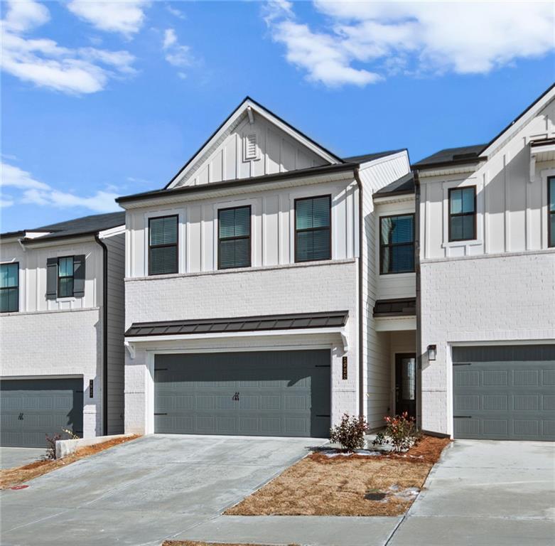 1925 Westwind Street Lawrenceville, GA 30043 - Photo 3 of 27 a front view of a house with yard