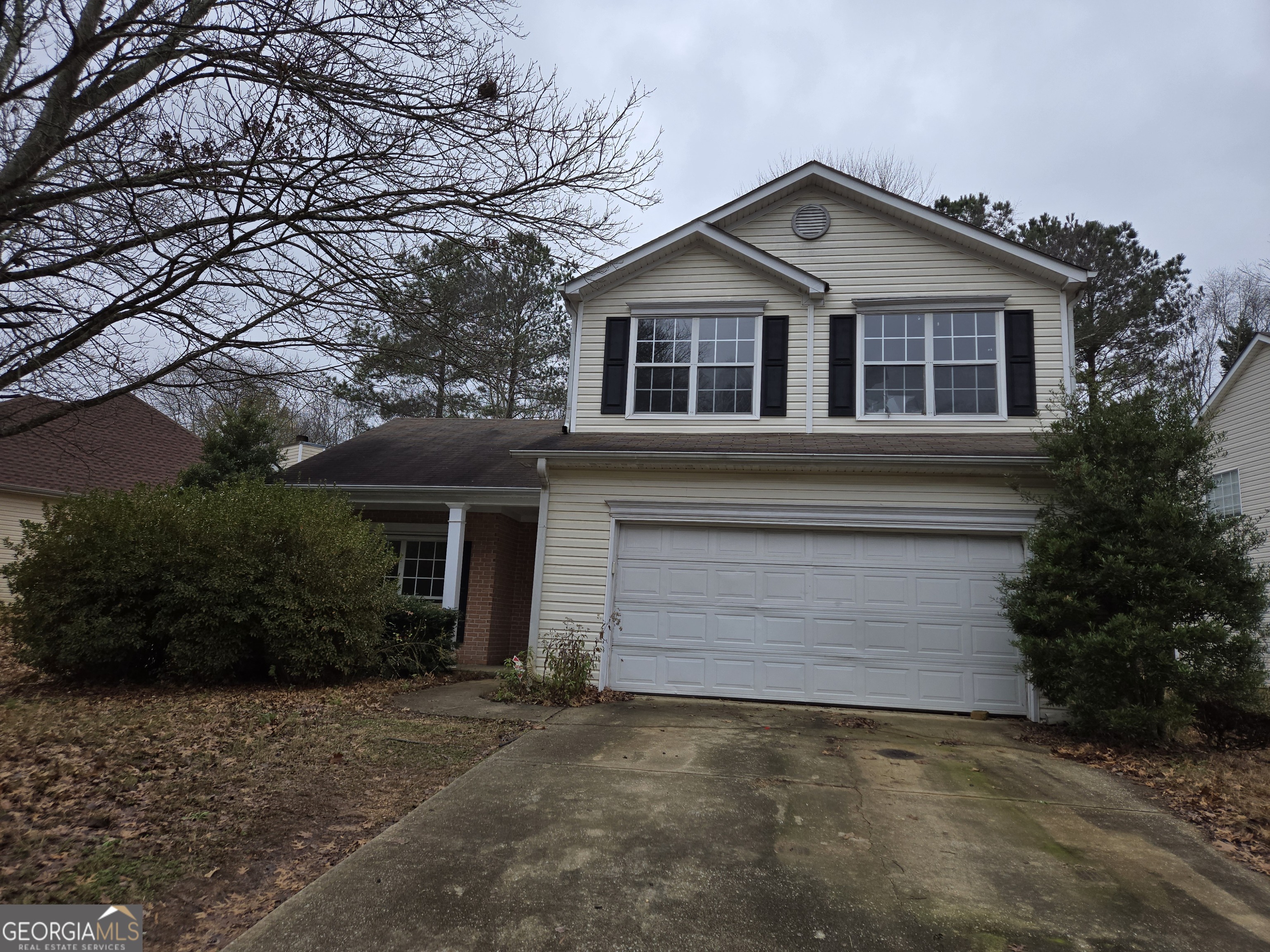 1558 Silver Ridge Drive Southwest Austell, GA 30106 - Photo 1 of 18 a front view of a house with a yard and garage