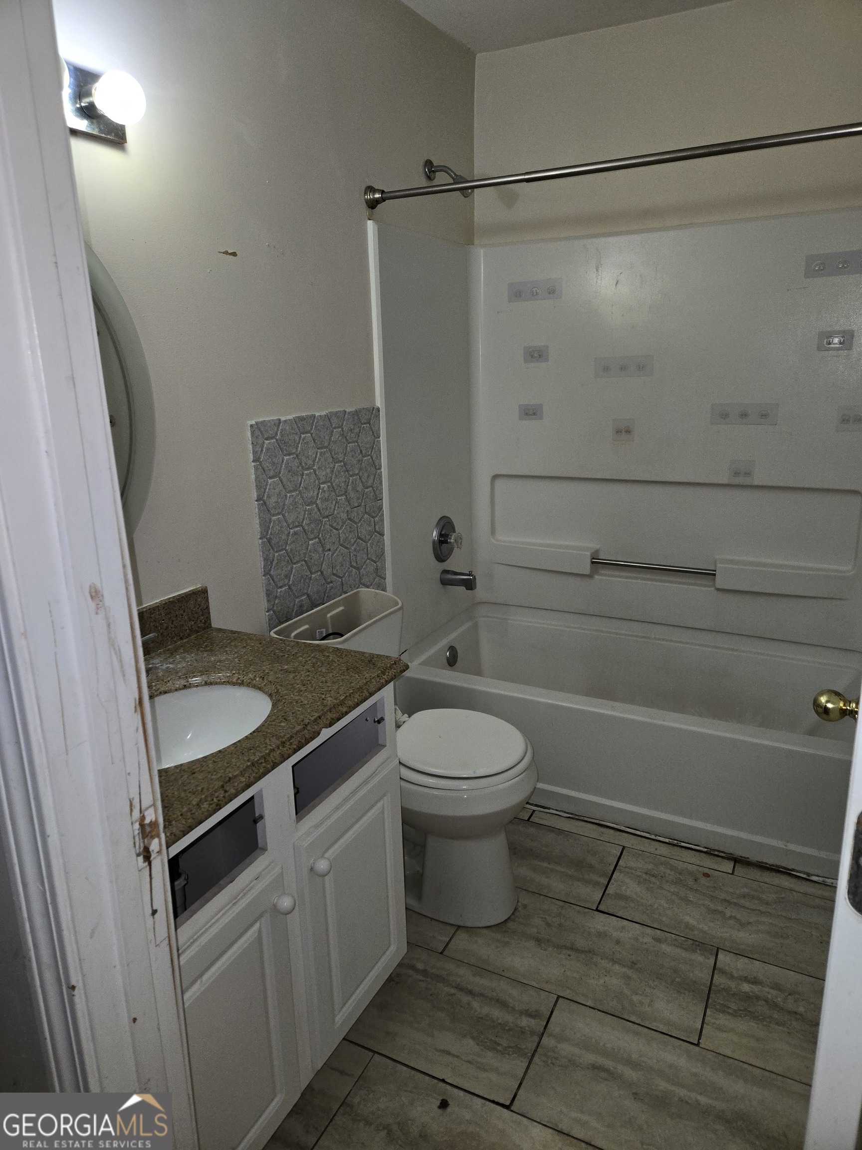1558 Silver Ridge Drive Southwest Austell, GA 30106 - Photo 11 of 18 a bathroom with a granite countertop sink a toilet and shower