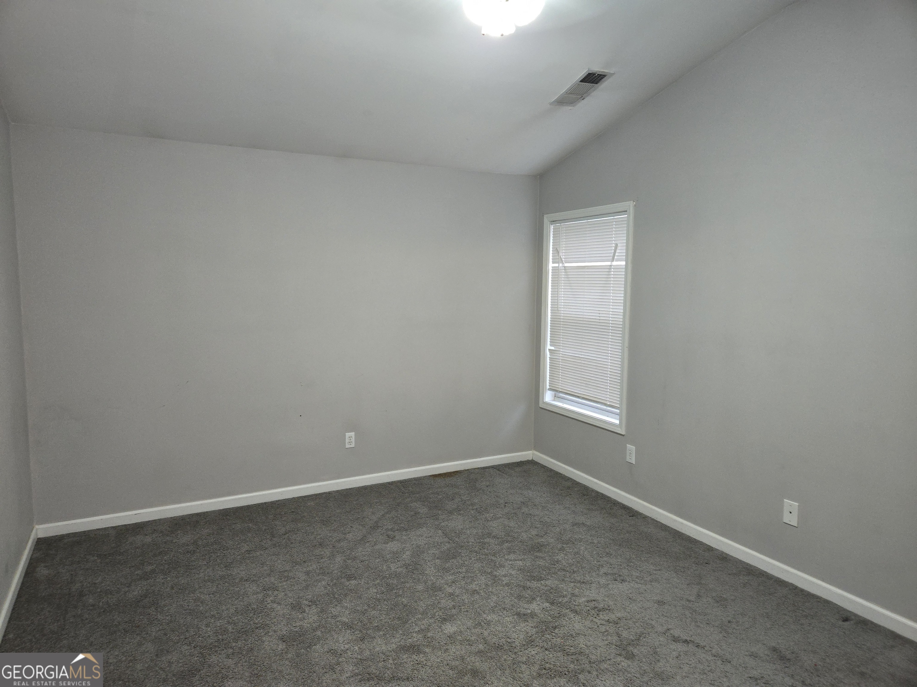 1558 Silver Ridge Drive Southwest Austell, GA 30106 - Photo 17 of 18 an empty room with a window