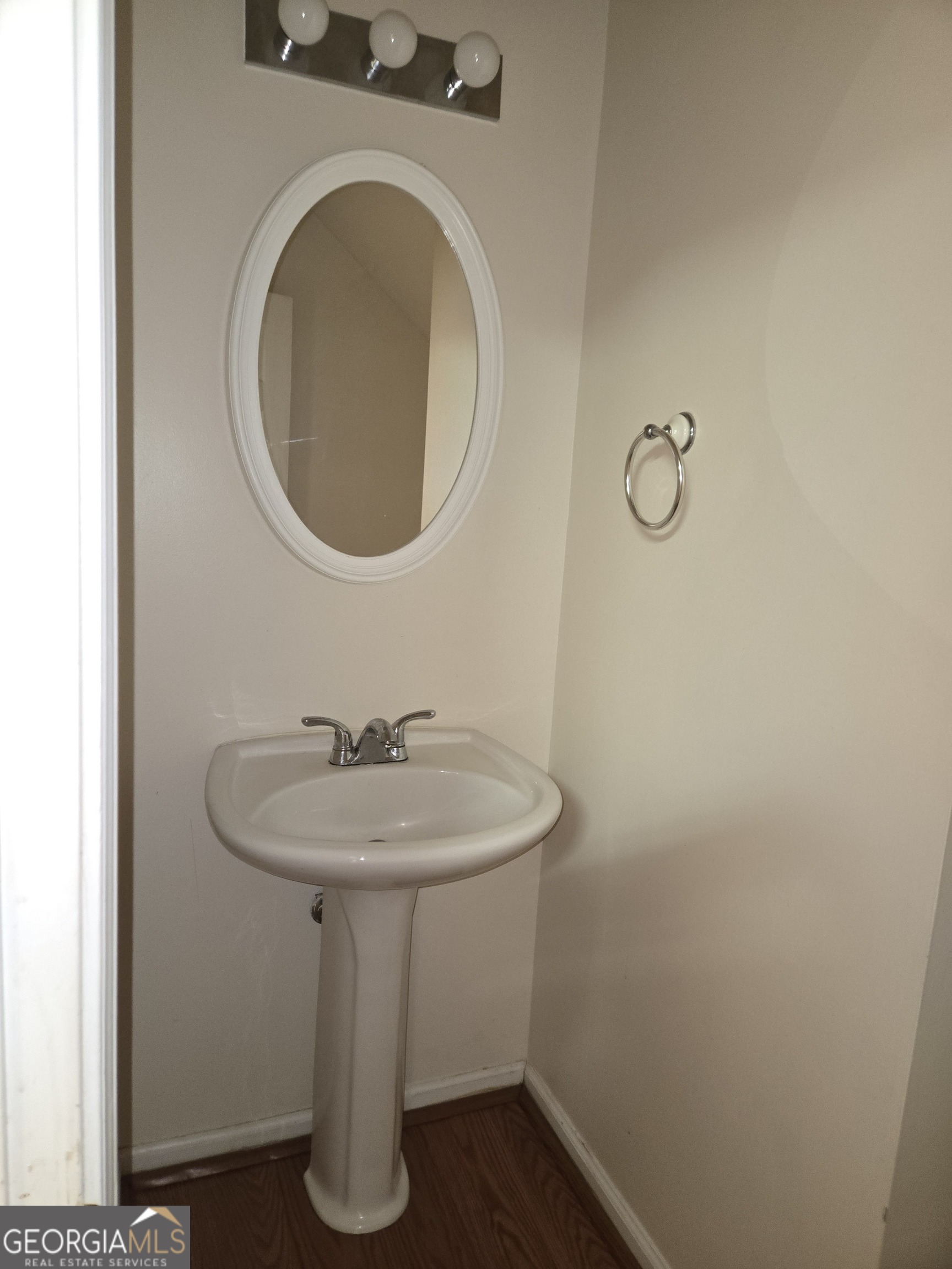 1558 Silver Ridge Drive Southwest Austell, GA 30106 - Photo 7 of 18 a bathroom with a sink and a mirror