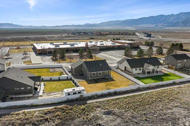 3938 North Wood Road Eagle Mountain, UT 84005 - Photo 51 of 55 Aerial view of residential area with mountains