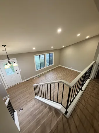 a view of a hallway with staircase
