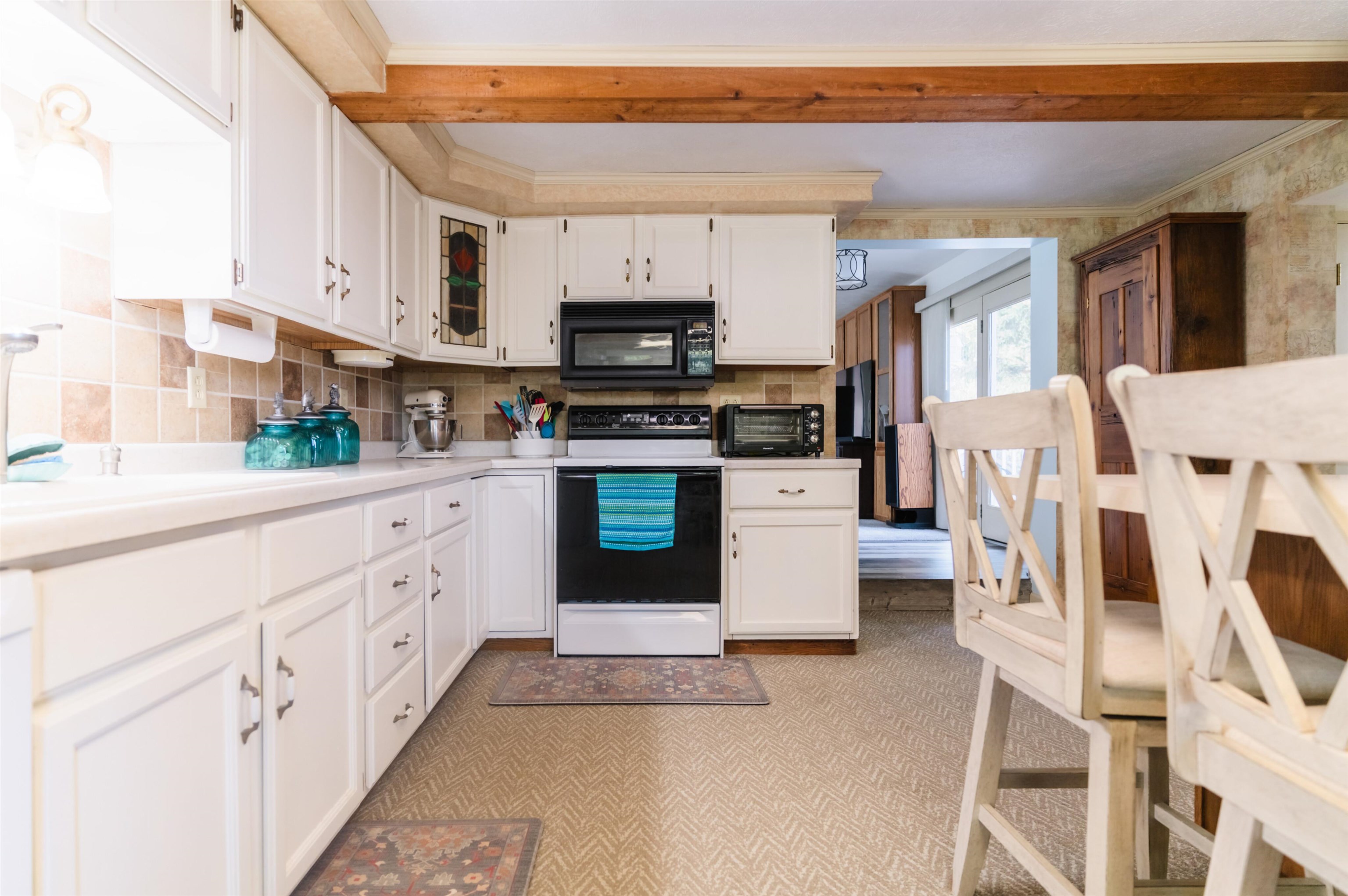 1406 Wheeler Road Cherry Valley, IL 61016 - Photo 15 of 35 a kitchen with stainless steel appliances granite countertop a stove a sink and a refrigerator