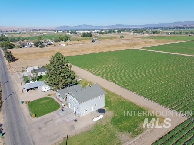 1520 Scheloske Road Weiser, ID 83672 - Photo 3 of 42 Gray exterior with white trim, a gabled roof, and attached carports