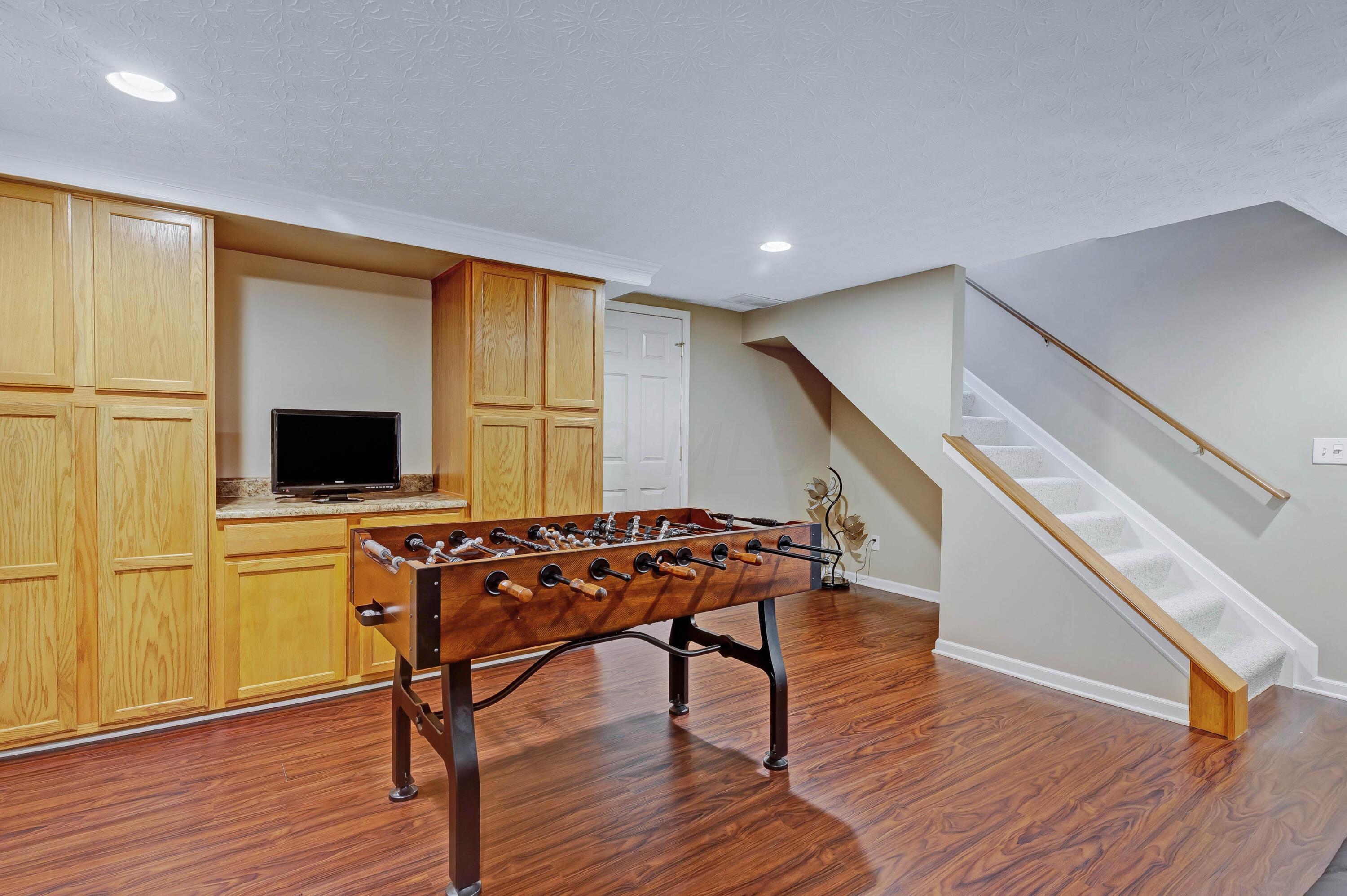 2136 Reeves Avenue Lewis Center, OH 43035 - Photo 44 of 57 • New luxury vinyl plank flooring ~ 2018 • Tan painted walls • Can lighting • Oak cabinets • Glass block window