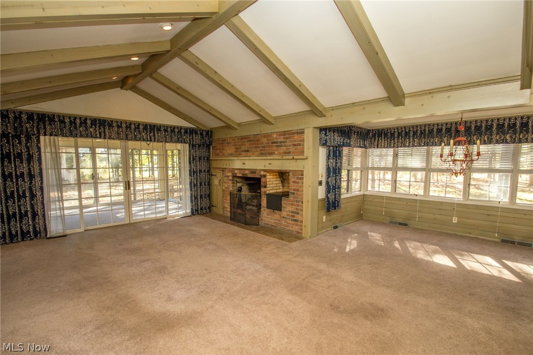 6900 Archwood Road Independence, OH 44131 - Photo 5 of 25 Vaulted Great room with Woodburning Fireplace and Sun Room
