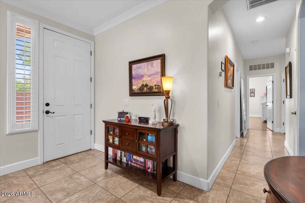 2600 East Springfield Place, Unit 87 Chandler, AZ 85286 - Photo 4 of 40 04-Warm inviting entry with tile everywh