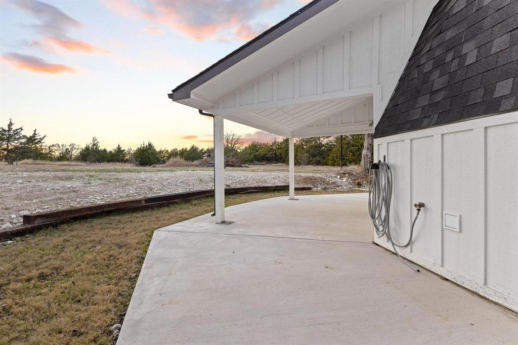 1325 Reynolds Road Whitewright, TX 75491 - Photo 28 of 39 a view of a room with wooden floor and fence
