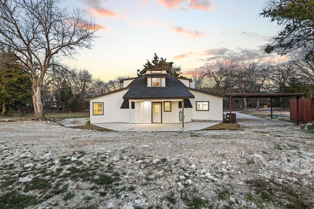 1325 Reynolds Road Whitewright, TX 75491 - Photo 30 of 39 a front view of a house with a yard