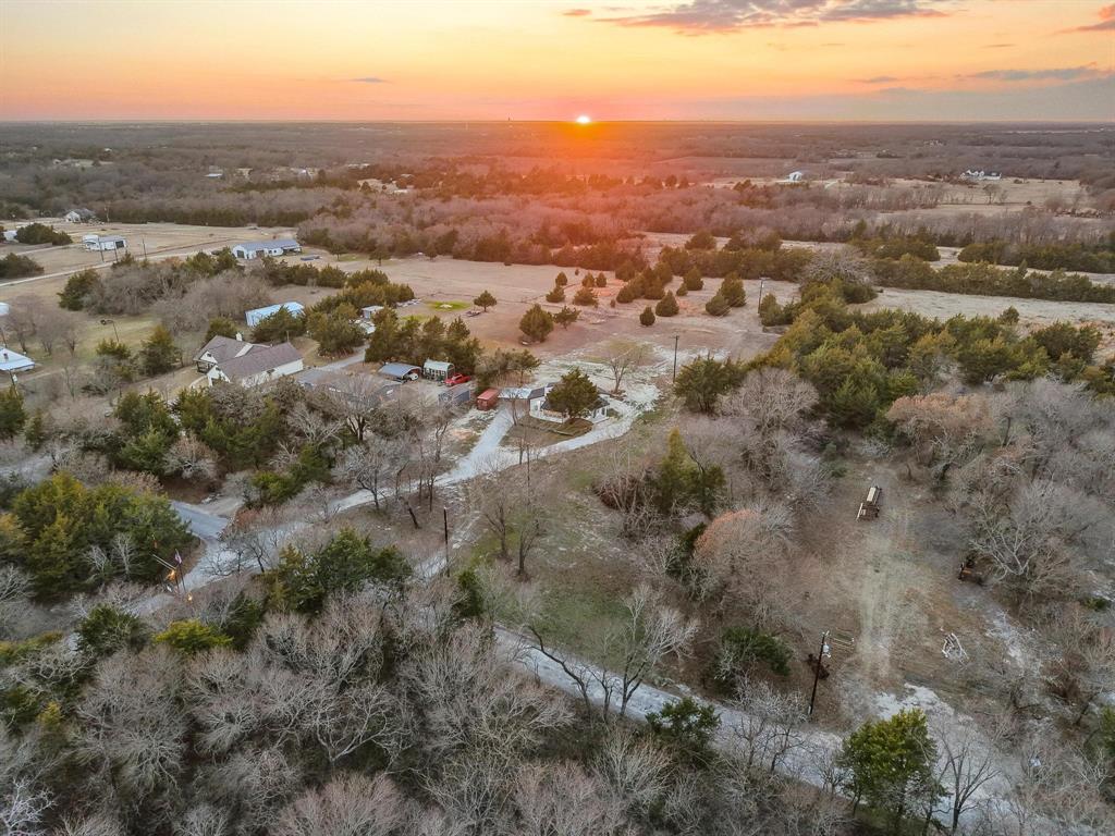 1325 Reynolds Road Whitewright, TX 75491 - Photo 37 of 39 an aerial view of house with yard and mountain view in back