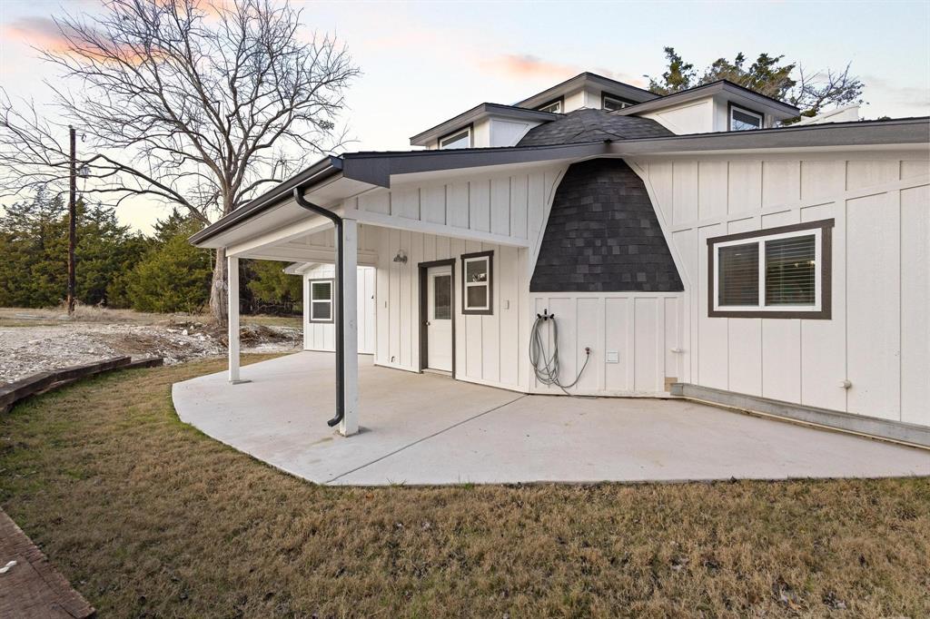 1325 Reynolds Road Whitewright, TX 75491 - Photo 6 of 39 a front view of a house with a yard