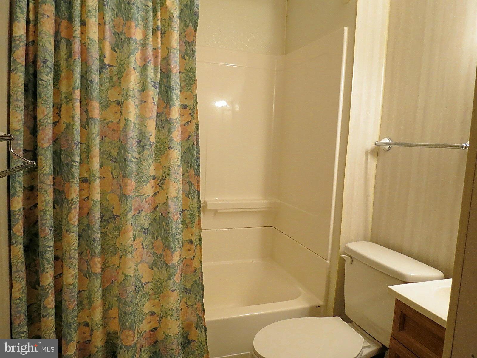 1650 Exeter Road Westminster, MD 21157 - Photo 13 of 18 a white toilet sitting next to a bathroom sink