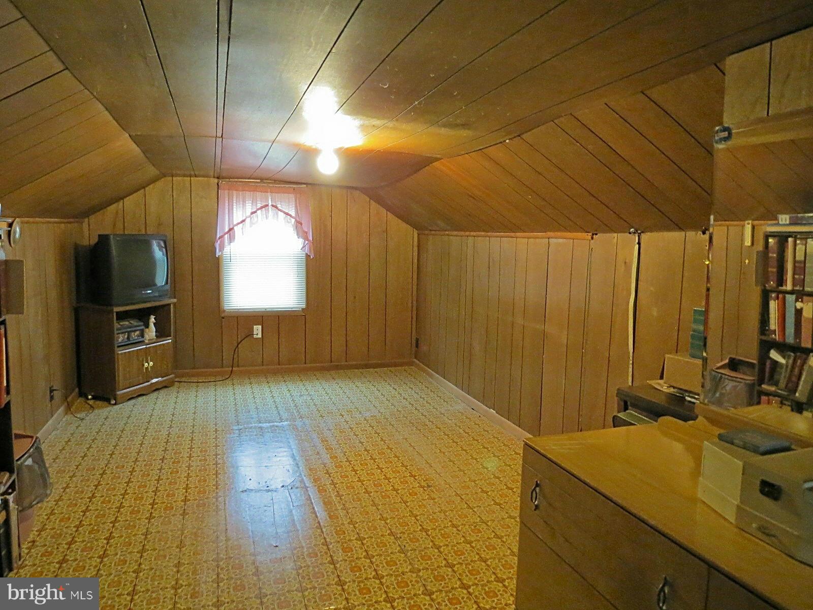 1650 Exeter Road Westminster, MD 21157 - Photo 14 of 18 a room with a bed and a flat screen tv