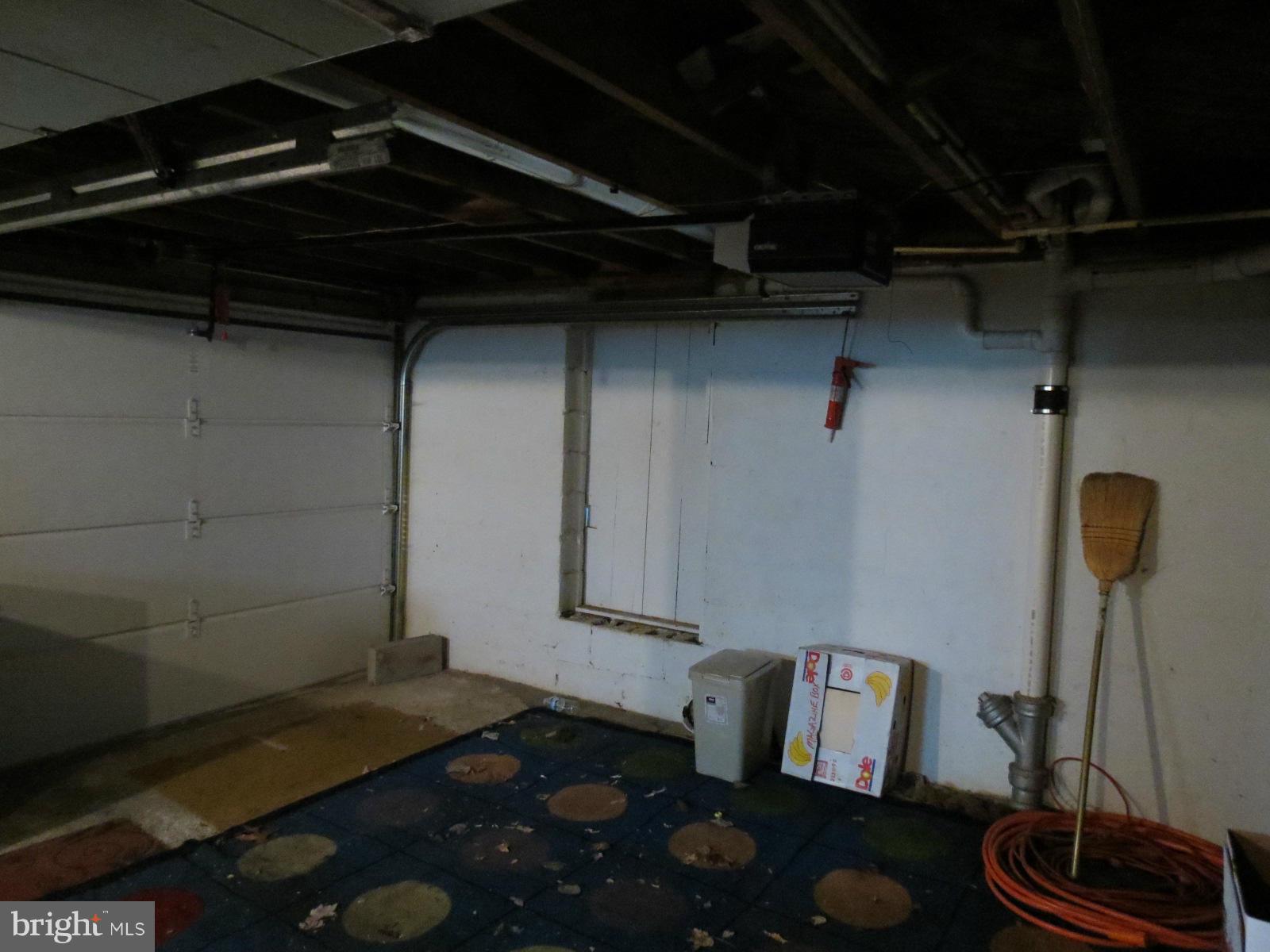 1650 Exeter Road Westminster, MD 21157 - Photo 16 of 18 a room with water heater and wooden cabinets